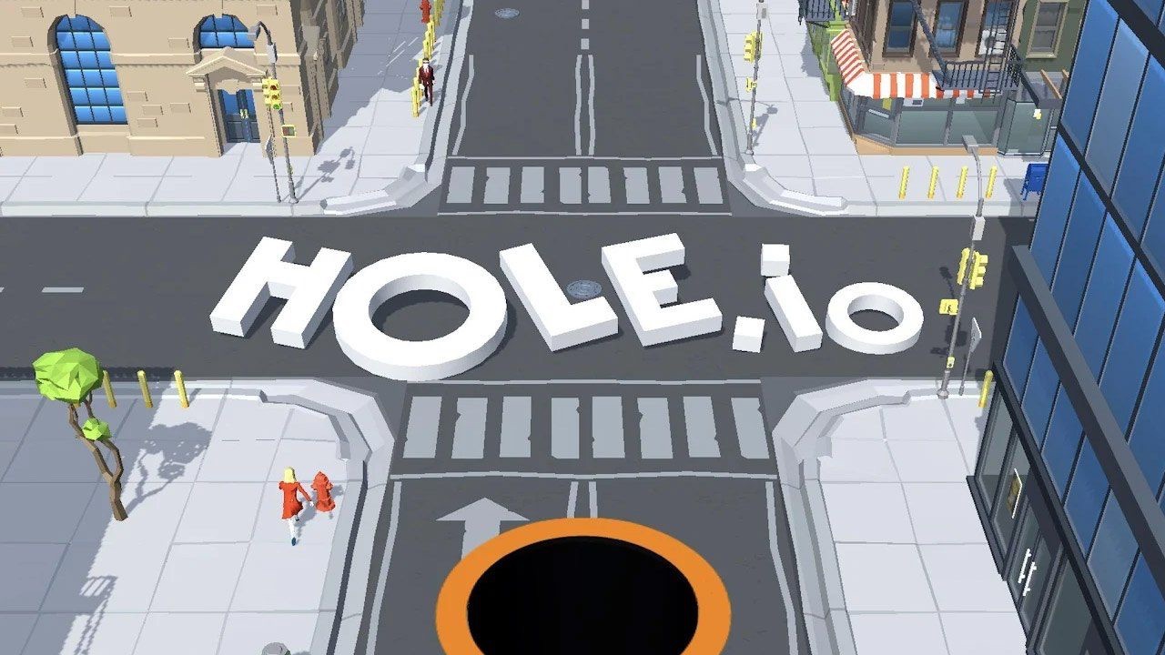 The featured image for our Hole.io guide, featuring a high angle shot of a city with the game's logo "Hole.io" in the middle of the cross roads.