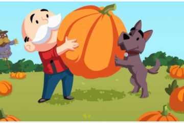 The image shows the Monopoly Man mascot and a cute brown terrier dog who is leaning against the pumpkin too.
