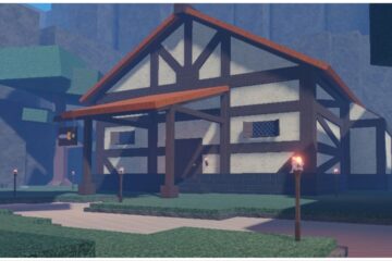 feature image for our clover retribution magic tier list, the image features a screenshot from the first area of the game, of a house supported by wooden beams sitting across the street, it is surrounded by lit torches, with a tree close by, and a large rock formation behind
