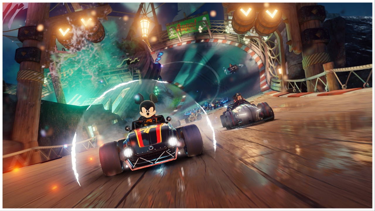 the image shows a determined mickey mouse at the lead of a race which has winding tracks. Surrounding him is a white aura which we can assume as a shield. Diffferent characters are not far behind him in this race