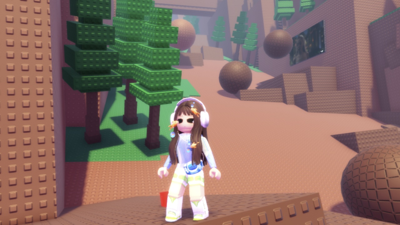 Image from the game Climb a Mountain To Feed Your Cat showing a character standing on a mountain with boulders falling and trees in the background.